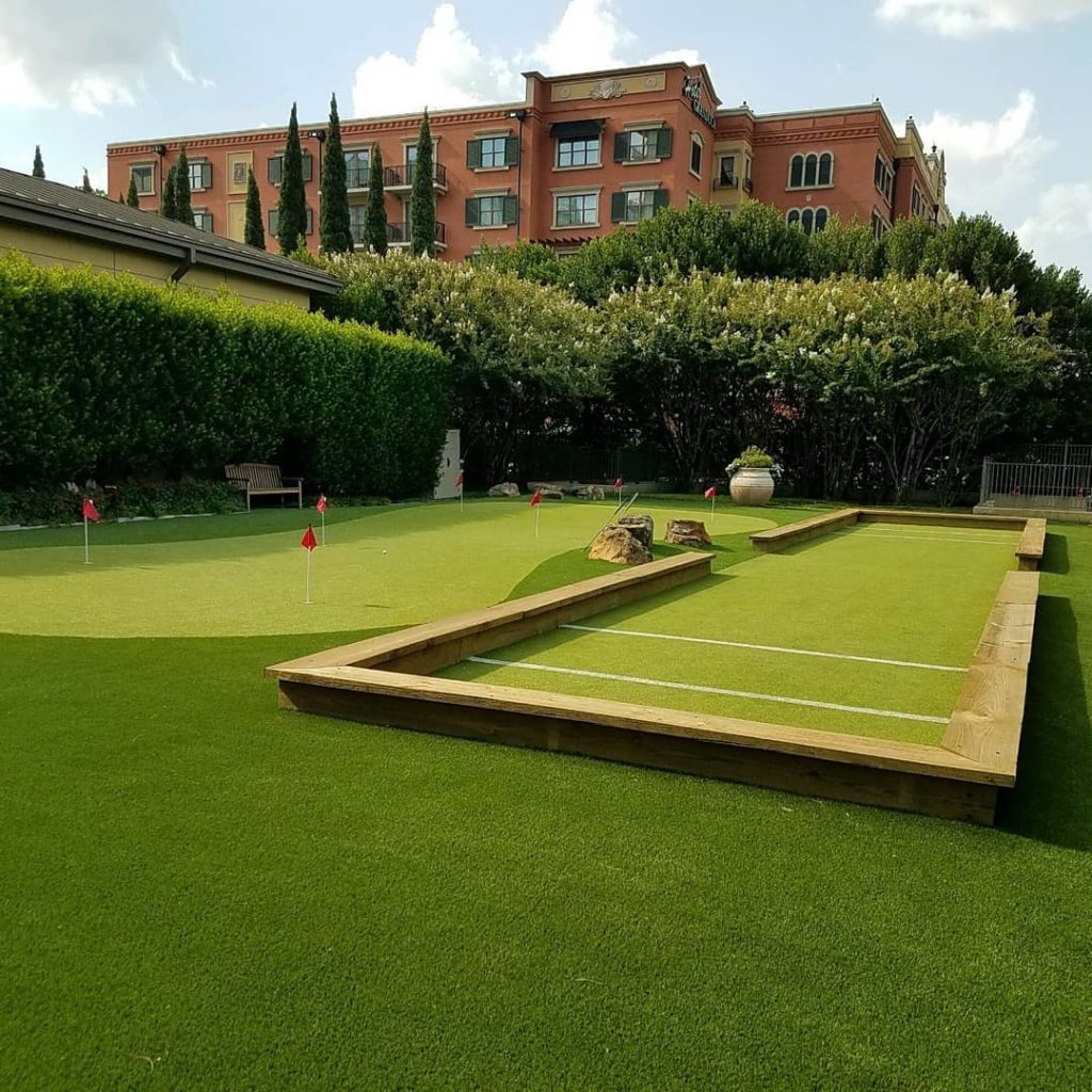 bocce court with artificial grass next to putting green